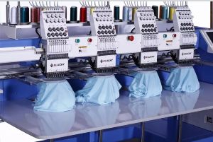 An embroidery machine with four different types of embroidery.