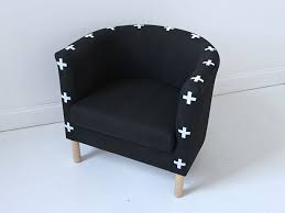 A black and white chair with crosses on it.