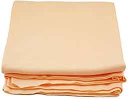 A stack of peach sheets on a white background.