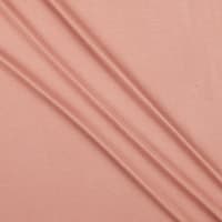 A close up of a pink fabric with Cupro Fabric history.