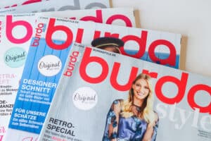 burda sewing magazine with several issues displayed on a table top TeachYouToSew.com